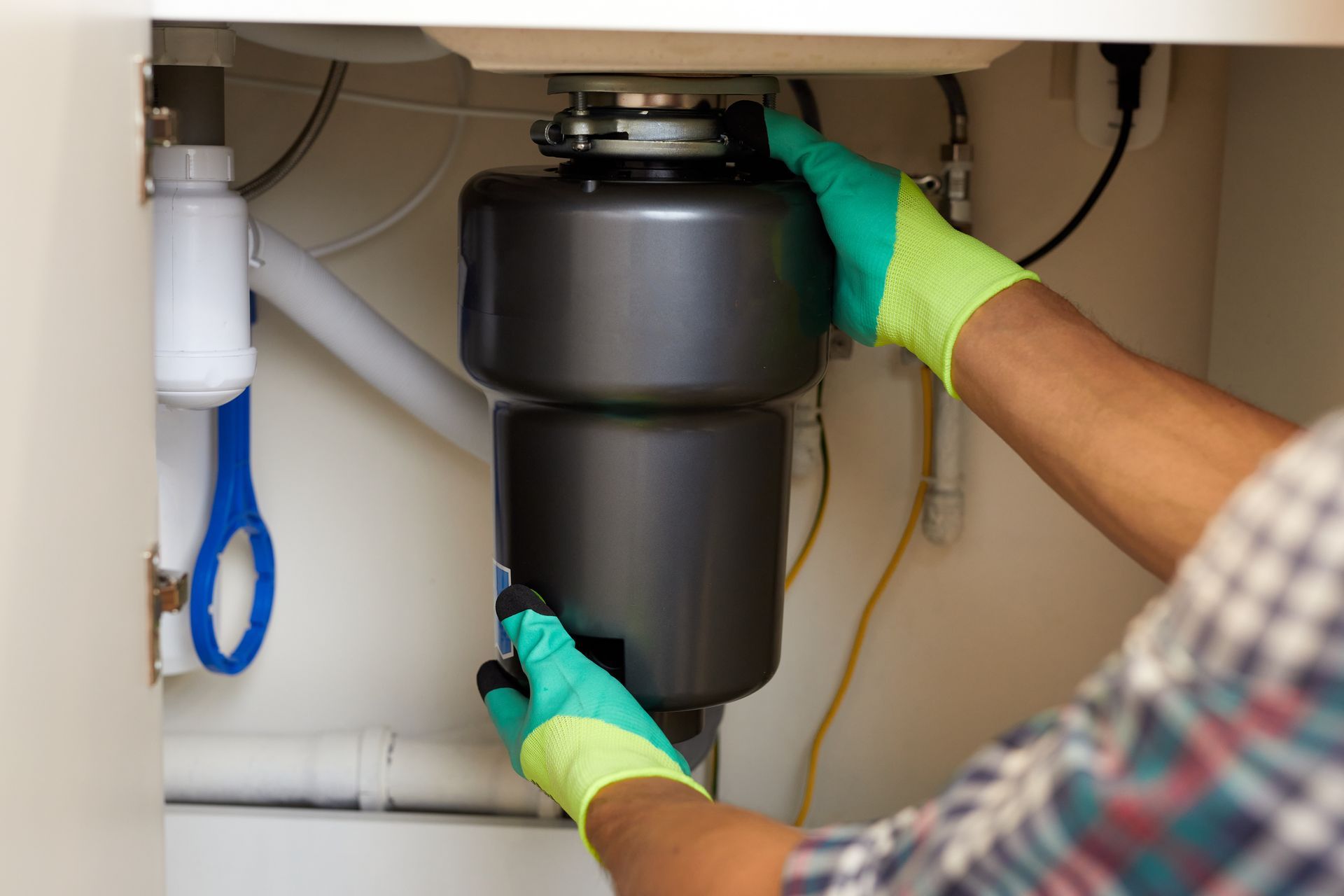 Garbage disposal being installed